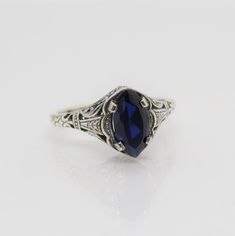 Sterling Silver Blue Sapphire Filigree Ring ....Marked 925...Total of weights 2.1grams..Size 10...Measure of Face 10.1MM...It's in very good condition. Mens Blue Topaz Rings, Sapphire Engagement Ring Men, Vintage Blue Sapphire Promise Ring, Vintage Blue Oval Sapphire Ring, Blue Sapphire Ring Stamped 925, Sterling Silver Sapphire Ring Stamped 925, Formal Sterling Silver Birthstone Engraved Ring, Classic Sapphire Ring Collectible, Formal Sterling Silver Engraved Ring With Birthstone