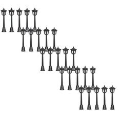 a set of six black street lights on top of each other in front of a white background