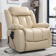 a beige recliner chair sitting on top of a rug