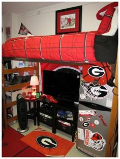 a bedroom with a bunk bed and a football themed rug on the floor next to it