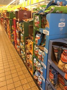 a grocery store aisle filled with lots of food and snacks on shelves next to each other