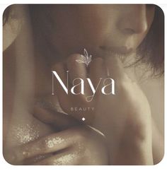 a woman with her hands on her chest and the words naya above her face