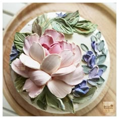 there is a cake decorated with flowers on the plate