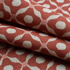 red and white fabric with circles on it