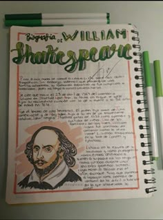 a spiral notebook with an image of shakespeare written on it and two green pens next to it