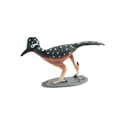 an animal figurine is standing on a white surface with polka dotty dots