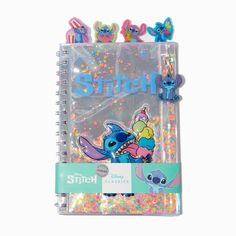 a spiral notebook with stitch and stitch characters on it