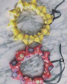 three different types of candy on a marble surface with black ribbon around the top and bottom