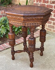 an old wooden table sitting on the sidewalk