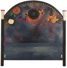 a painted headboard with flowers and butterflies on the top, against a white background