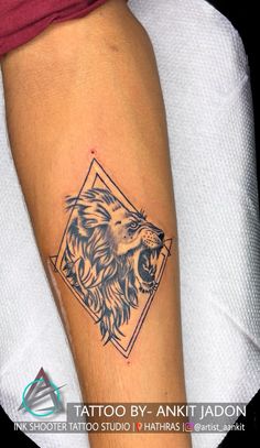 a lion tattoo on the arm