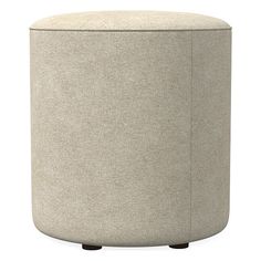 a round ottoman with wooden legs and a light colored fabric upholstered seat cover