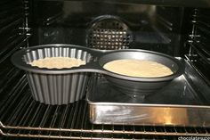 two pans filled with batter in an oven