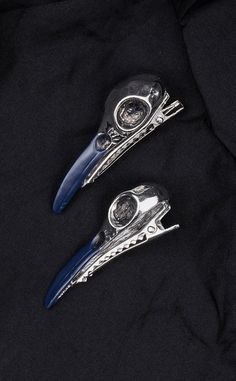 Quoth the Raven, Nevermore.These stunning silver raven skull hair clips are the perfect balance of stylish & spooky! The perfect gothic hair accessory to add a splash of darkness to your hair style for any occasion - how stunning would these look in a goth bridal up style? Divine. Each clip is made from cast metal in shiny silver chrome with the beak dipped in a brilliant deep indigo colour. Sold Singly. Size: 6cm long. Gothic Hair Accessories, Goth Accessories, Gothic Hairstyles, Raven Skull, Indigo Colour, Alternative Hair, Metal Casting, Shiny Silver, Up Styles