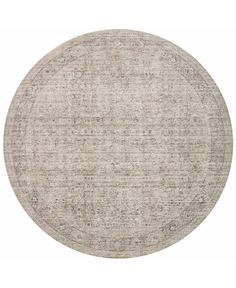 a round rug with an over - dyed design on the top and bottom, in grey tones