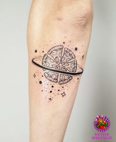 a black and white tattoo on the leg of a person with a pizza slice in it