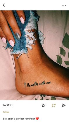 a woman's foot with the words, he walks with me tattooed on it