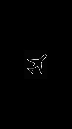 an airplane is flying in the dark with white lines on it's side and bottom