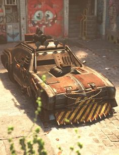 an old, rusted out vehicle parked in front of a building with graffiti on the walls