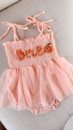 Beautiful one romper for your little pumpkin babe. This listing is for a pink color romper, one lettering in coral and a pumpkin appliqué next to it.  Birthday photoshoots, special events, etc. If you'd like a different color or saying, don't hesitate to contact us Pumpkin Turns One Party, First Birthday Ideas Fall, Fall Birthday Outfit, Birthday Romper, Kylie Birthday, Pumpkin 1st Birthdays, First Birthday Outfit Girl, Pumpkin Applique