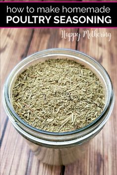 a glass jar filled with homemade poultry seasoning sitting on top of a wooden table