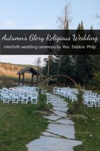 an outdoor ceremony set up with white chairs