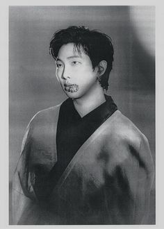 black and white photograph of a man in kimono