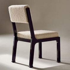 Inspired by classic Hollywood Regency style and the minimalism of Italian midcentury, the Mireille upholstered dining chair by goop stands out with its understated details. Finished with a high-gloss black lacquer, solid beech wood shapes the chair's angled silhouette, softened by custom ivory boucle. Inspired by high-end Parisian textiles, wool and cotton yarns are blended for softness and texture, drawing you in with its delicate irregularity. andamp;quot;We leaned into complex materiality for Gold Furniture, Fabric Sectional Sofas, Unique Sofas, Texture Drawing, Woven Chair, Wood Shapes, Leather Sectional Sofa, Formal Dining Tables, Hollywood Regency Style