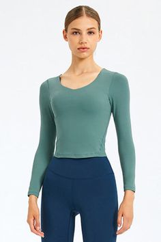 Sizing: Slim fit Pattern: Solid Features: Long sleeve. removable bra pads. fitness wear Necline: Round neck Sheer: No Stretch: Highly stretchy Product measurements: 4: length 17 in. bust 28 in. hem 26 in. sleeve 21 in6: length 18 in. bust 30 in. hem 27 in. sleeve 22 in8: length 18 in. bust 31 in. hem 29 in. sleeve 22 in10: length 19 in. bust 33 in. hem 30 in. sleeve 22 in12: length 19 in. bust 35 in. hem 32 in. sleeve 23 in Material composition: 80% nylon. 20% spandex Care: Machine wash cold... Sports Tops With Built-in Bra, Casual Long Sleeve Tops With Built-in Bra, Fitted Crop Top With Built-in Bra For Gym, Stretch V-neck Crop Top For Workout, Fitted Sports Top With Built-in Bra, Gym Tops With Built-in Bra, Fitted Crop Top With Built-in Bra For Pilates, Yoga Tops With Built-in Bra And Compression, Seamless Long Sleeve Athleisure Tops