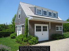 an image of a house that looks like it has two garages on each side