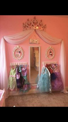 a room with pink walls and white curtains