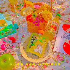 a table topped with lots of food and drinks on top of a white table cloth