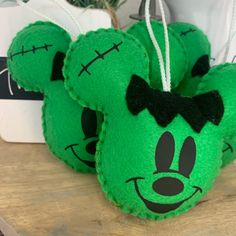 green mickey mouse ornament with black bow