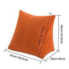 an orange pillow with the measurements for it