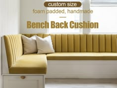 a bench with pillows on it in front of a window that reads custom size foam padded, handmade bench cushion