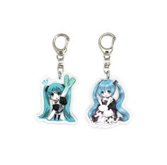 two keychais with anime characters on them, one is blue and the other is white