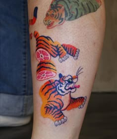 a person with a tiger tattoo on their leg