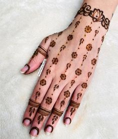 hendi tattoos on the palm of a woman's hand