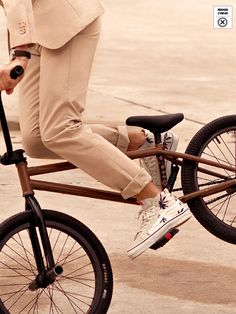 a man riding on the back of a bike