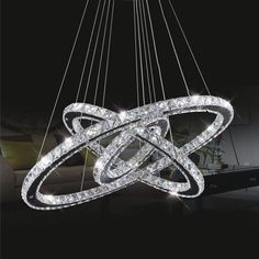 a modern chandelier with crystal balls hanging from it's center, and an award