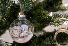 an ornament hanging from a christmas tree filled with musical notes and ornaments,