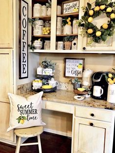 a desk with some lemons on top of it and a coffee maker in the corner