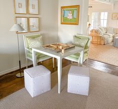 a living room with two chairs and a table