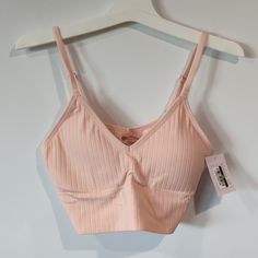 Pink Lightly Lined V-Neck Bralette By Auden. Size: 34c, 34d, 36b, 36c Pink Stretch V-neck Bra, Pink Stretch V-neck Camisole, Feminine Seamless Bra For Loungewear, Spring Camisole Bra For Loungewear, Feminine Spring Loungewear Bra, Spring Loungewear Camisole Bra, Trendy Seamless Pink Camisole, Pink Bra-friendly Crop Top For Loungewear, Pink Bra Friendly Crop Top For Loungewear