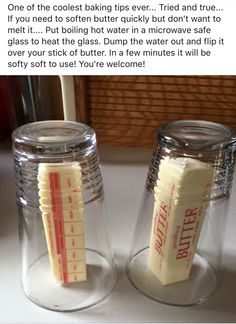 two jars with fake toothbrushes in them sitting on a counter next to each other