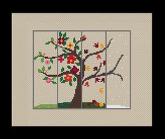 a cross stitch tree with leaves and flowers