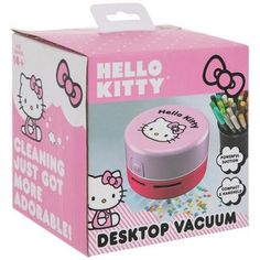 the hello kitty desk top vacuum is in its pink box and it's open