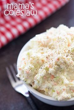 a white bowl filled with mashed potatoes on top of a table