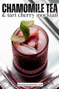 a close up of a drink in a glass on a tray with the words chamomile tea and tart cherry mochai