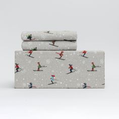 three sheets with skiers and snowflakes on them